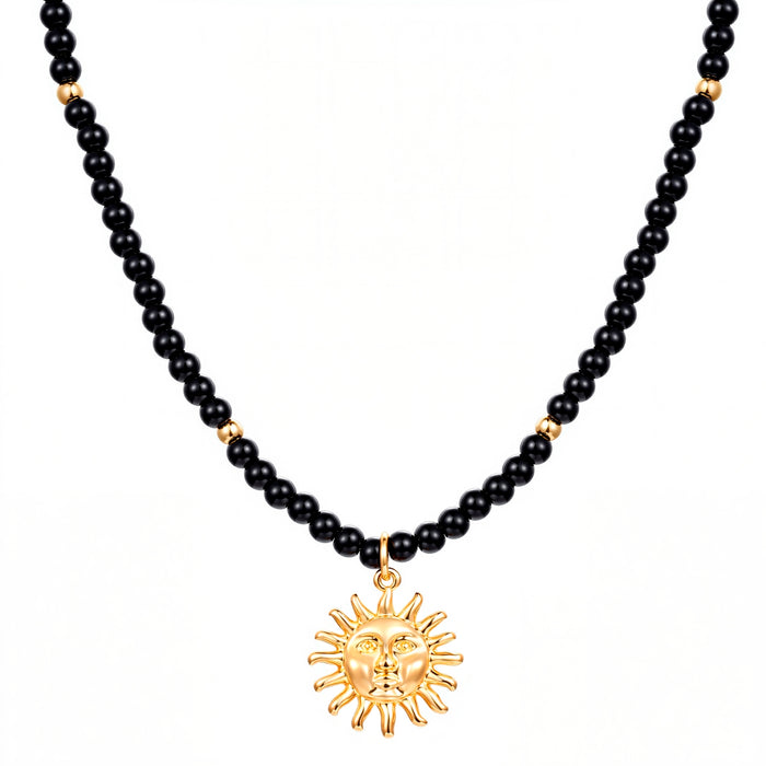 Kette mit Anhänger gelbgold Glas schwarz