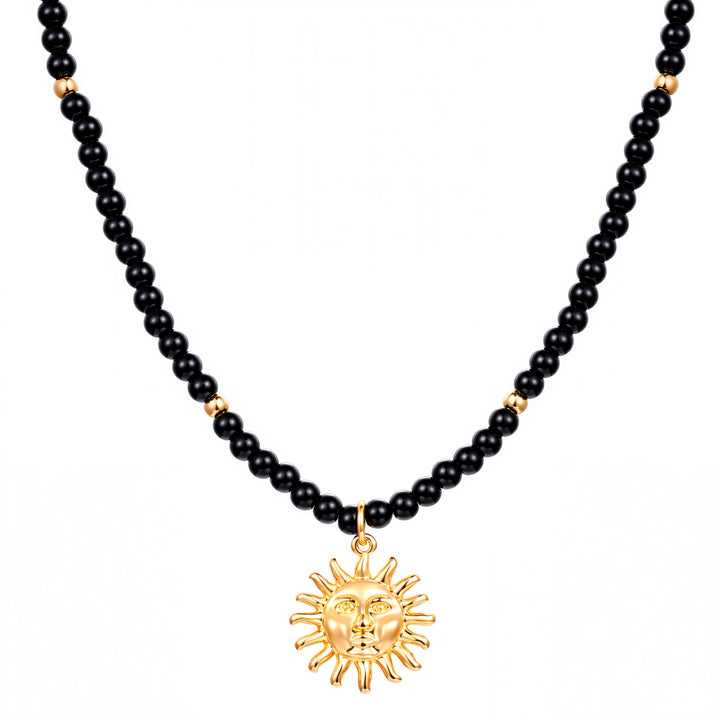 Kette mit Anhänger gelbgold Glas schwarz